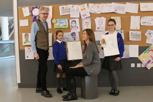 Picture of four people drawing in The Lowry galleries